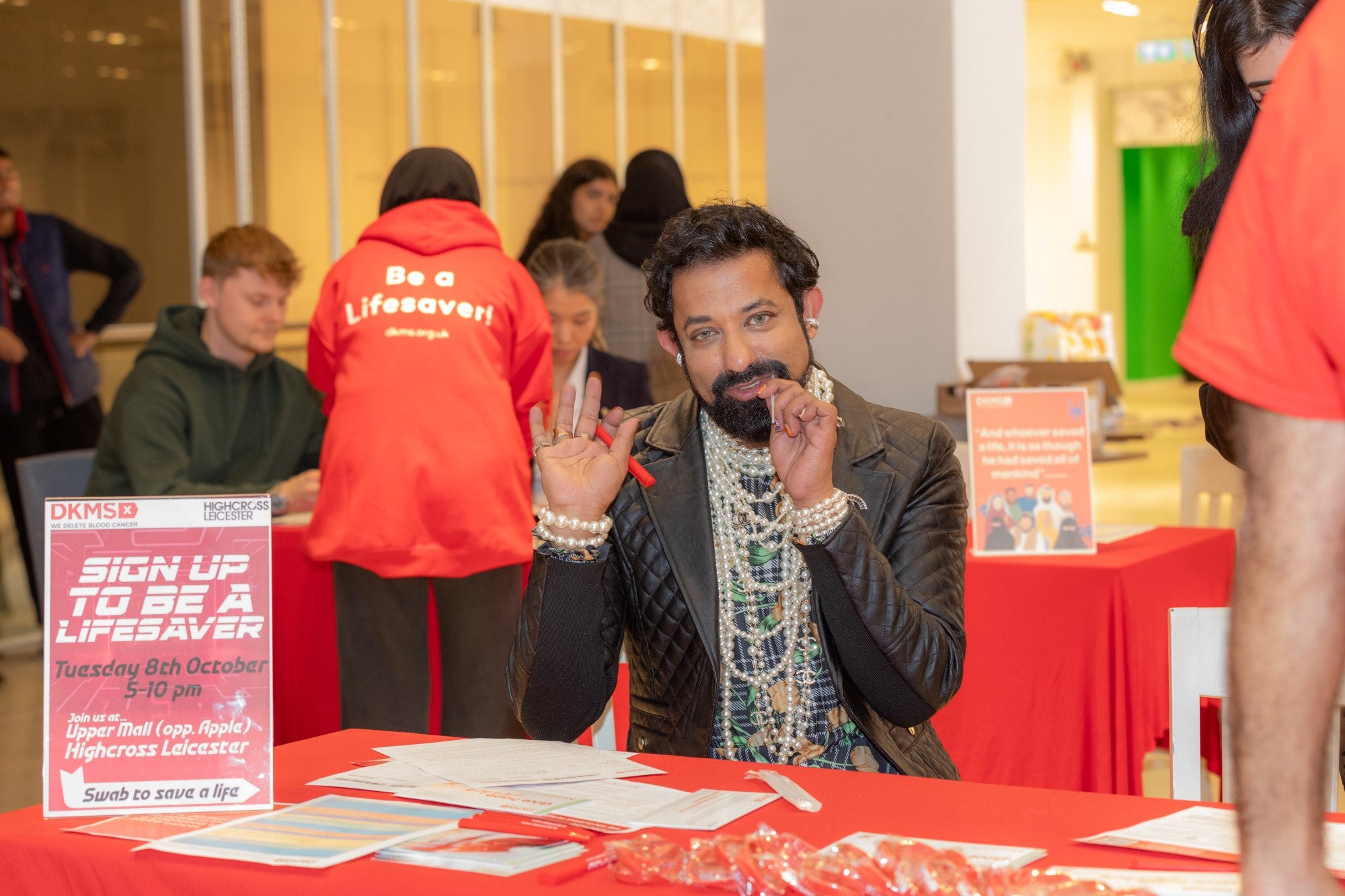 Asian man smiling at a dkms event