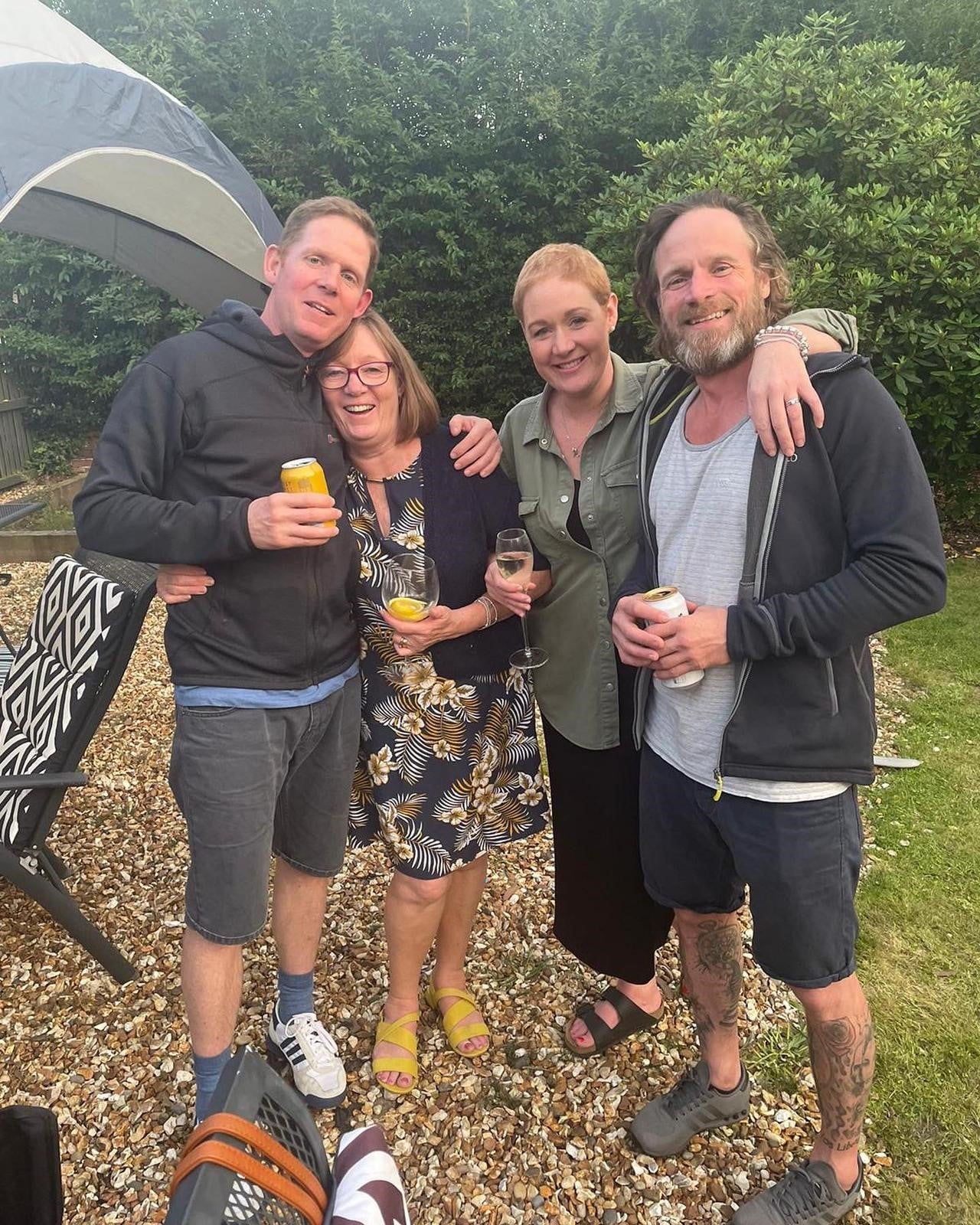Peter (left) next to his mum and Helen, with other brother Michael on the right.