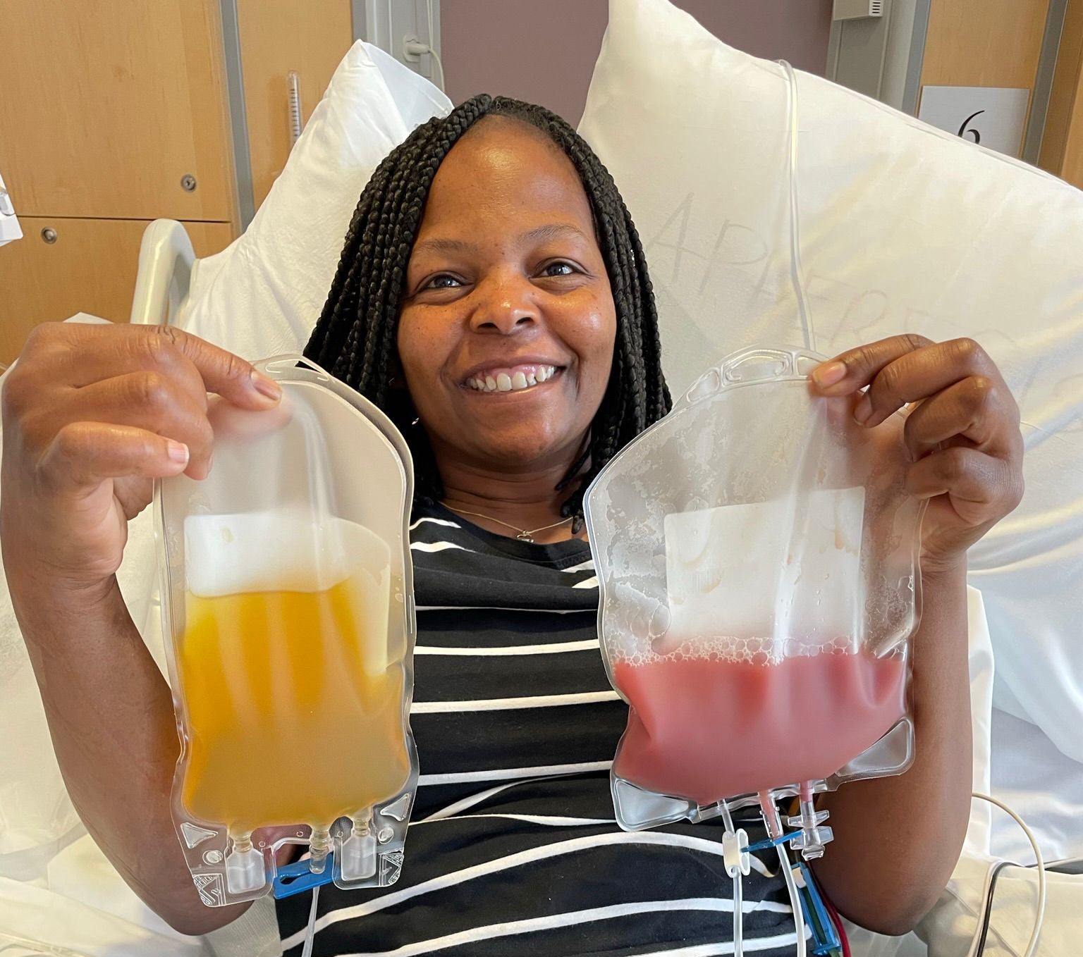 Purity holding her donation bags