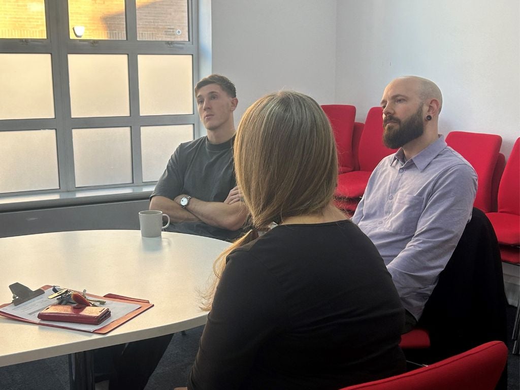 Jimmy Dunne sitting at the table with DKMS UK team members