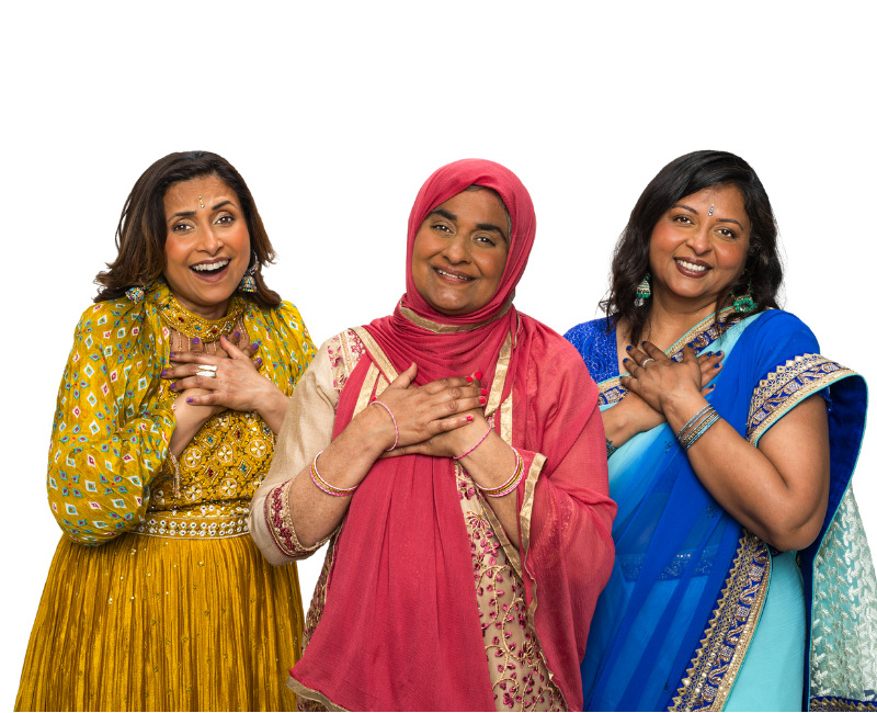 Three middled aged Asian women in sarees smiling 