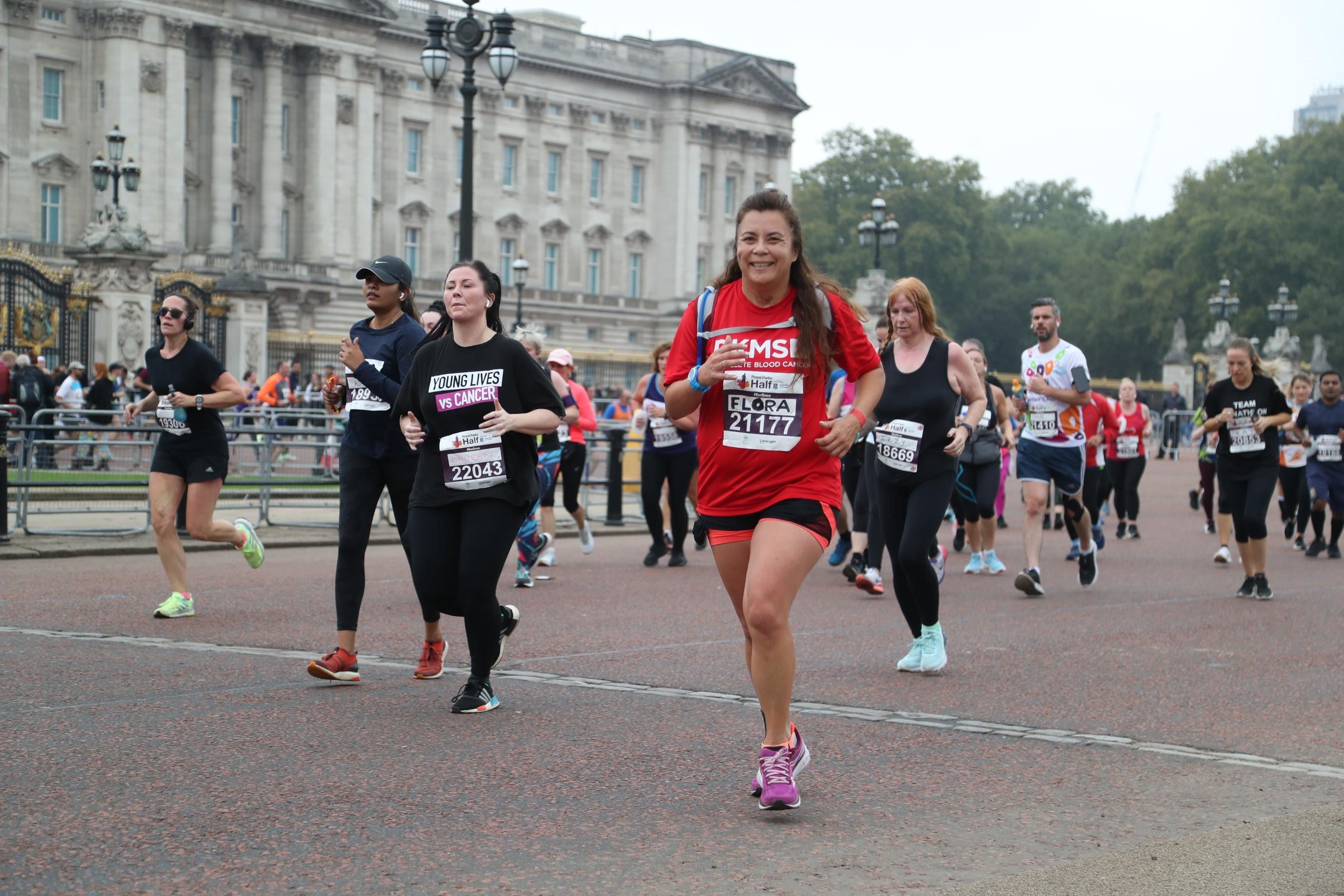 Lady in DKMS t-shirt running in London