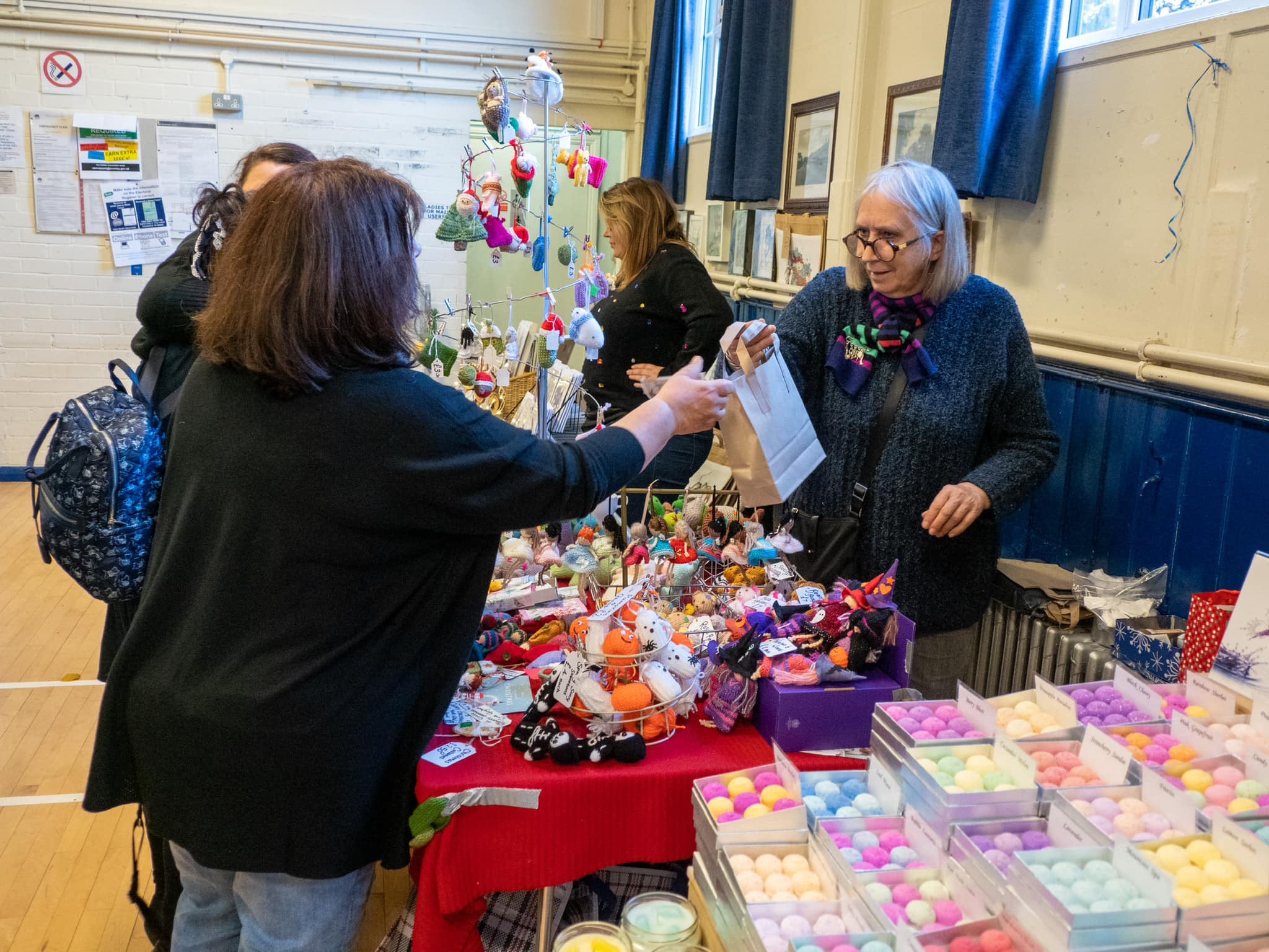 Barbara Baldwin with customers at a craft fair