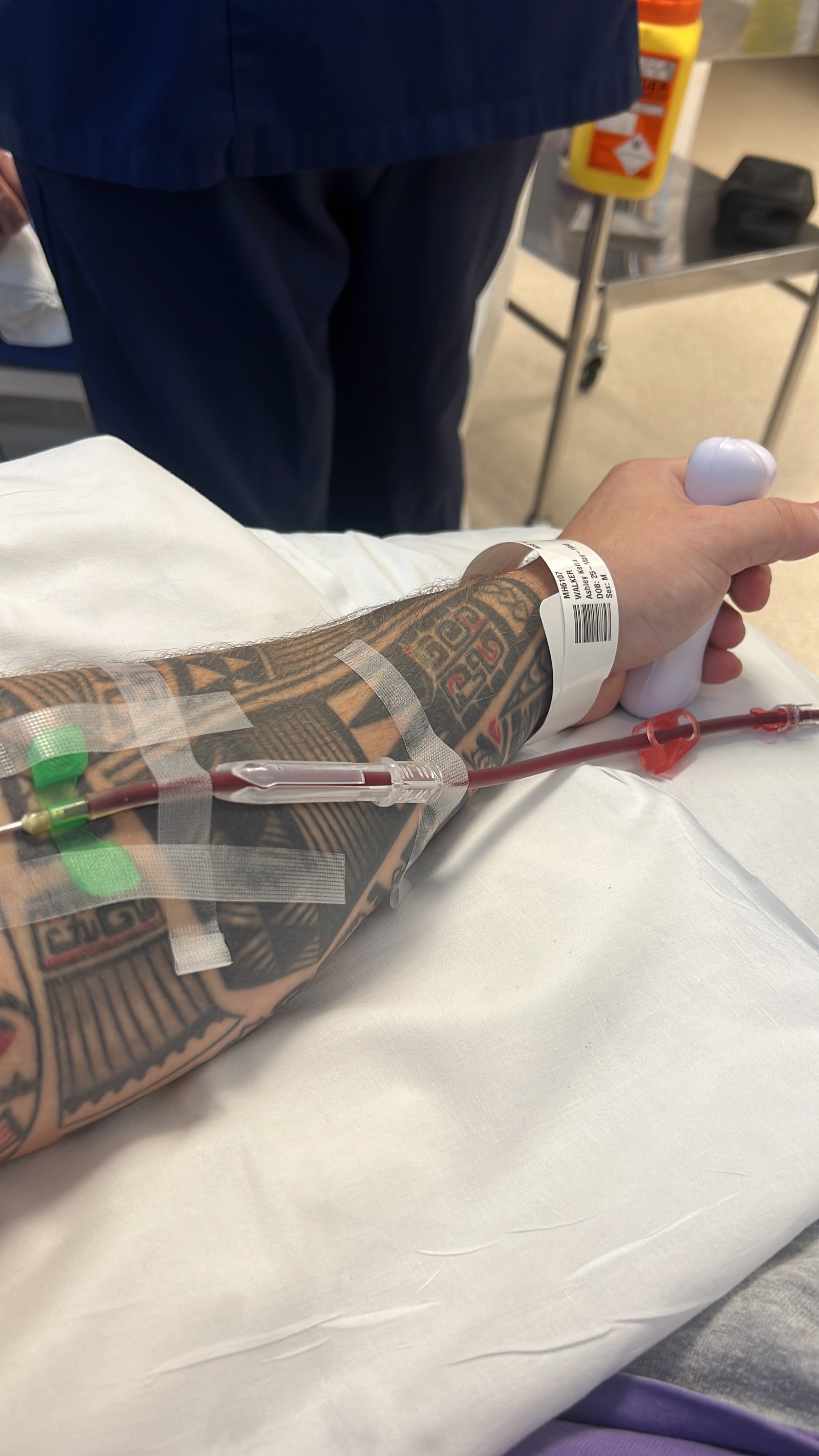 Ashley's arm showing the blood moving to the apheris machine