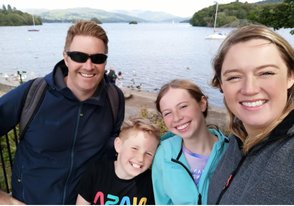 James, wife Emma and kids smiling into the camera