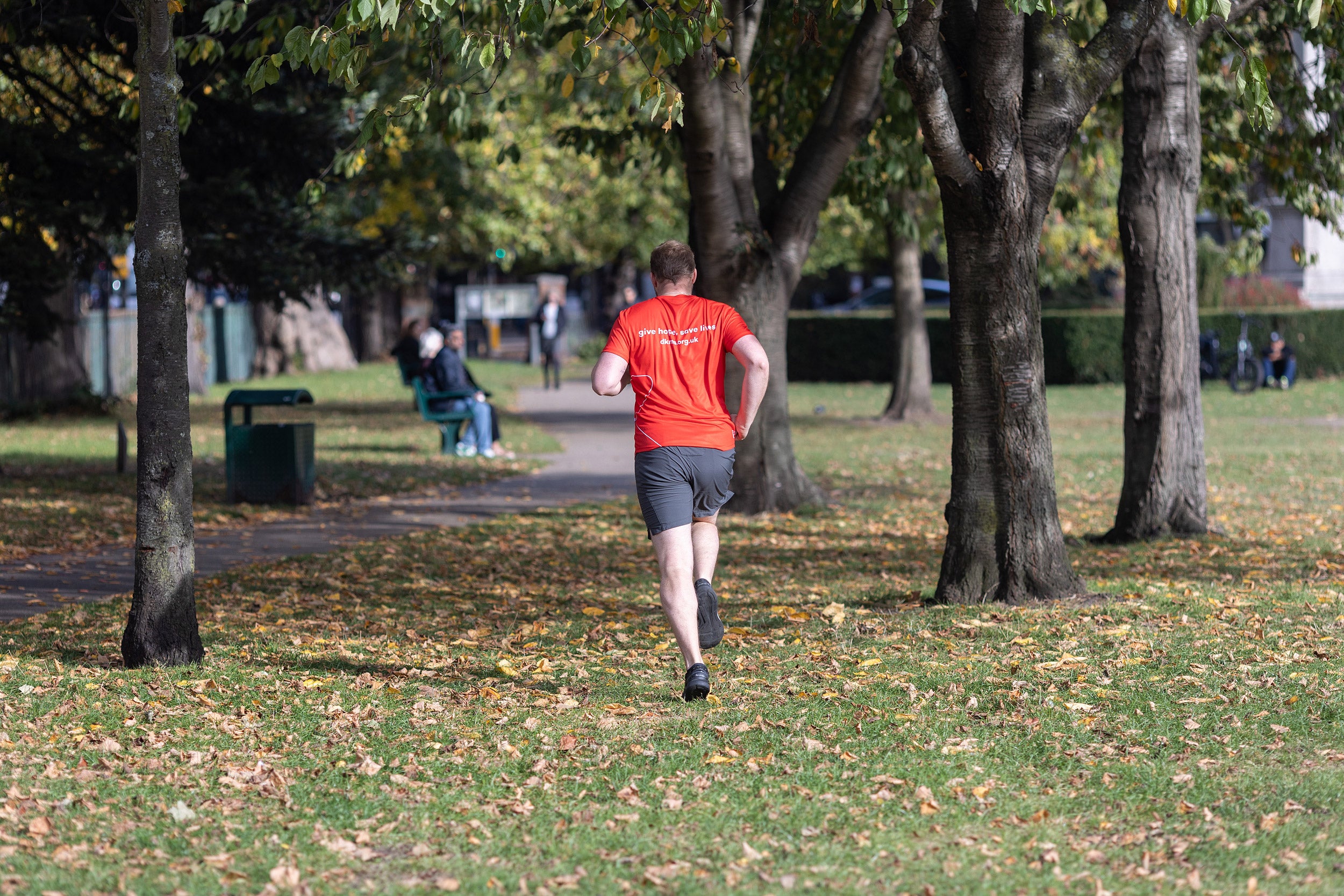 Man in red t-shirt running