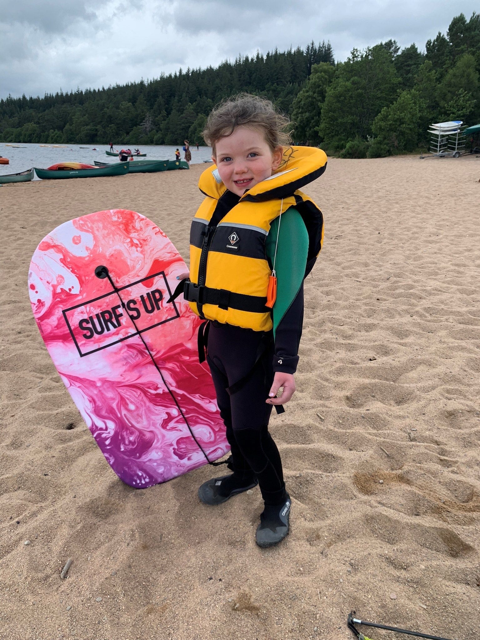 Image of Erin at the beach with bodyboard 