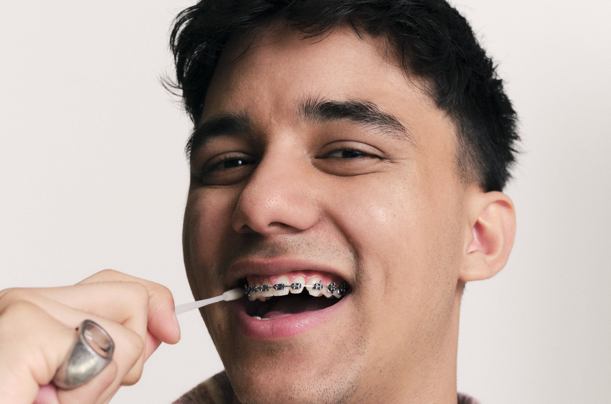 Model Ashim doing the swab for the new DKMS UK campaign "Do The Swab"