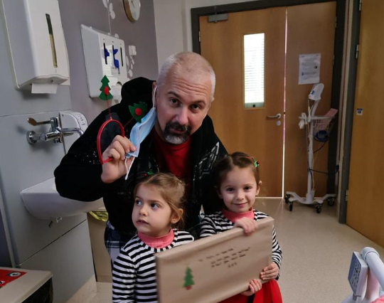 George with his twin daughters