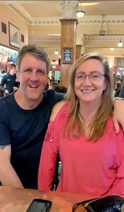 Man & Woman Smiling in restaurant