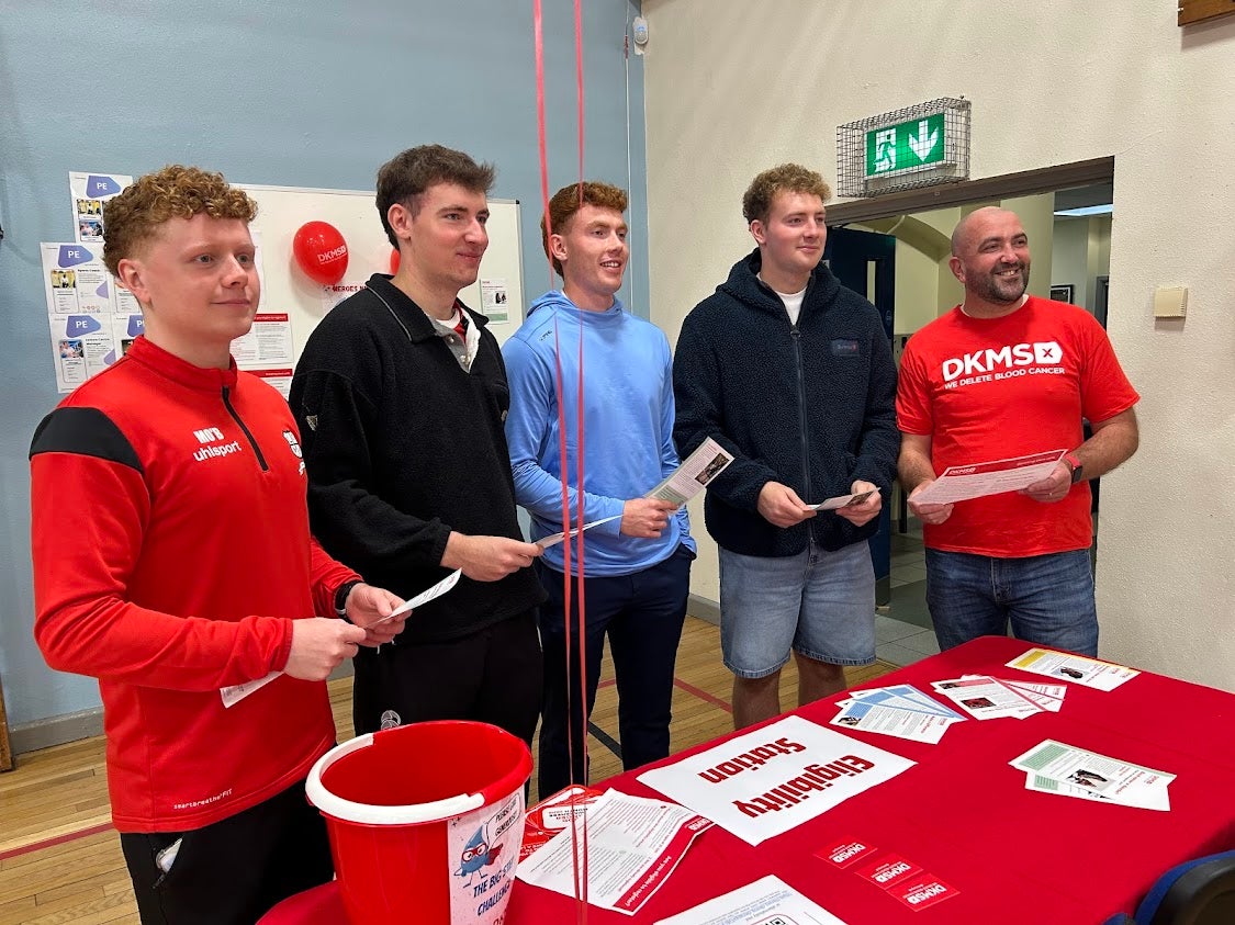 Five men around a table