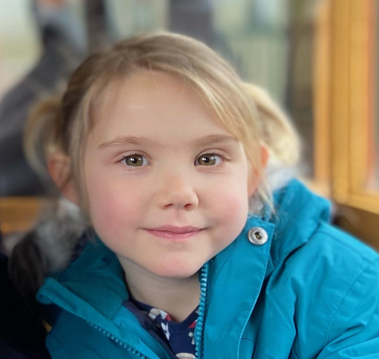 Emilia in a blue anorak