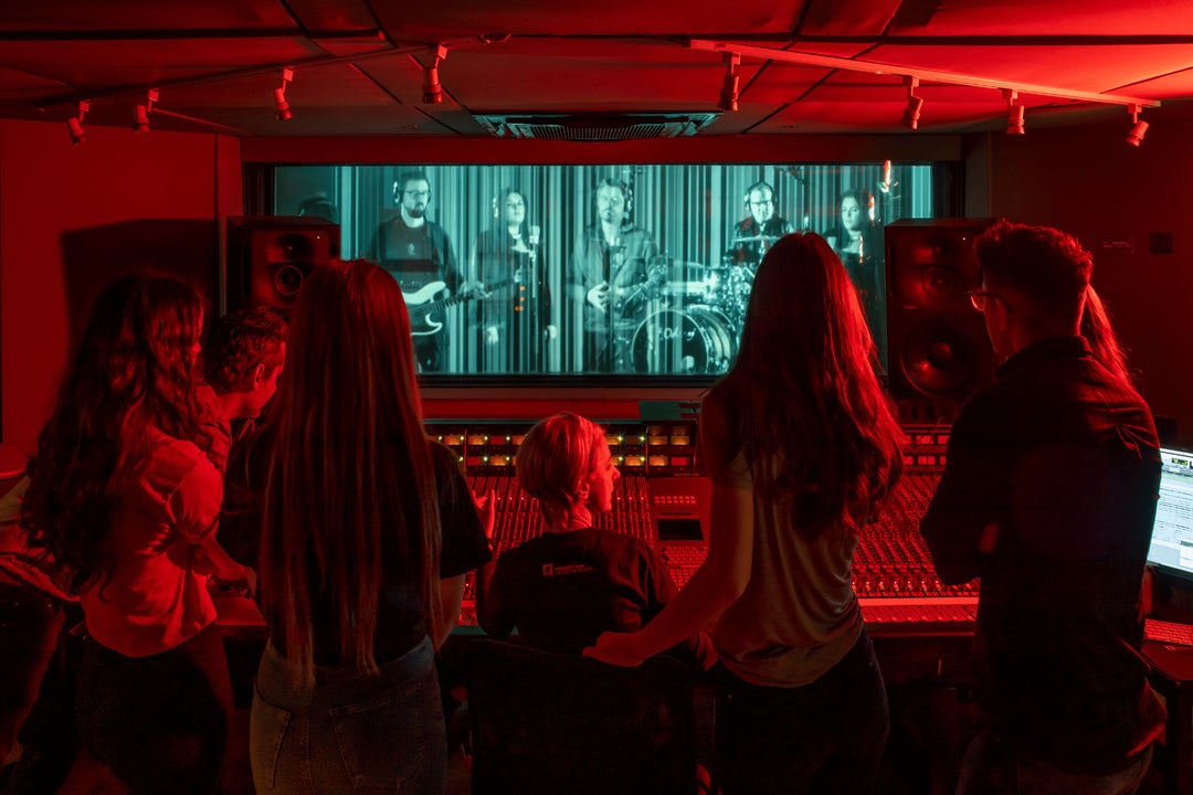 Group of visitors experiencing the Virtual Band in Studios