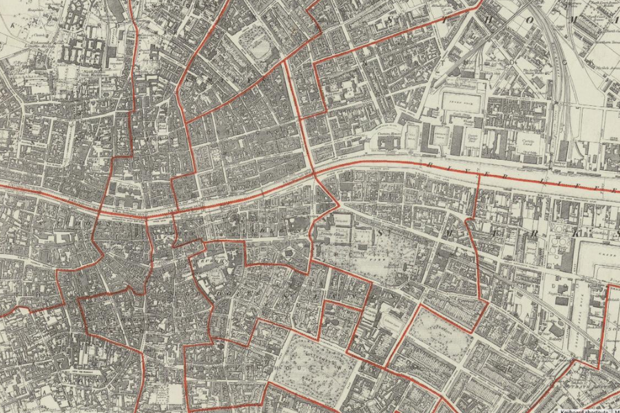 A detailed historic map of Dublin showing tight streets, buildings and districts in monochrome, with bold red boundary lines marking valuation areas. The map has an aged, archival look ideal for genealogy and family‑history research.