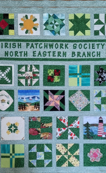 Exhibition: Thread Therapy, Irish Patchwork Society North Eastern Branch, a patchwork quilt mostly in shades of blue and green.