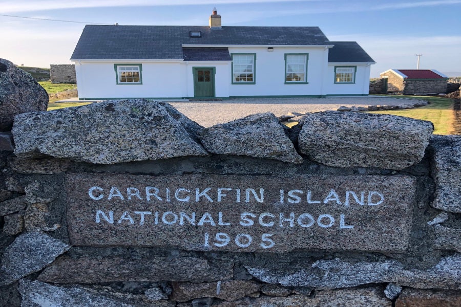 Exterior of house with stone wall entrance
