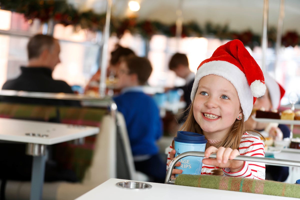 A child wearing a Santa hat on a Vintage Tea Trips tour in Dublin city 