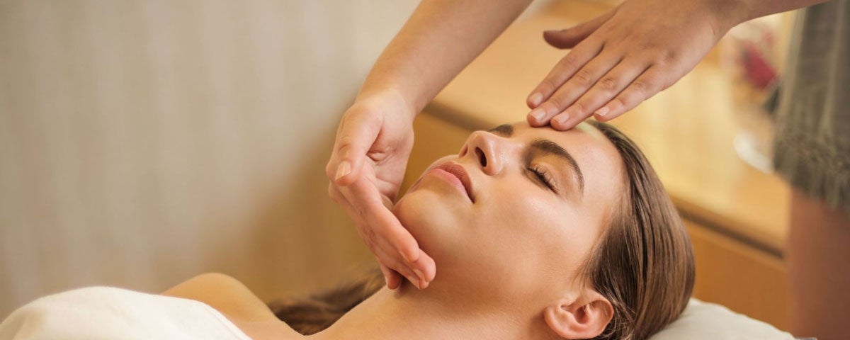 A lady relaxing with a facial massage at Balance Therapy Donegal