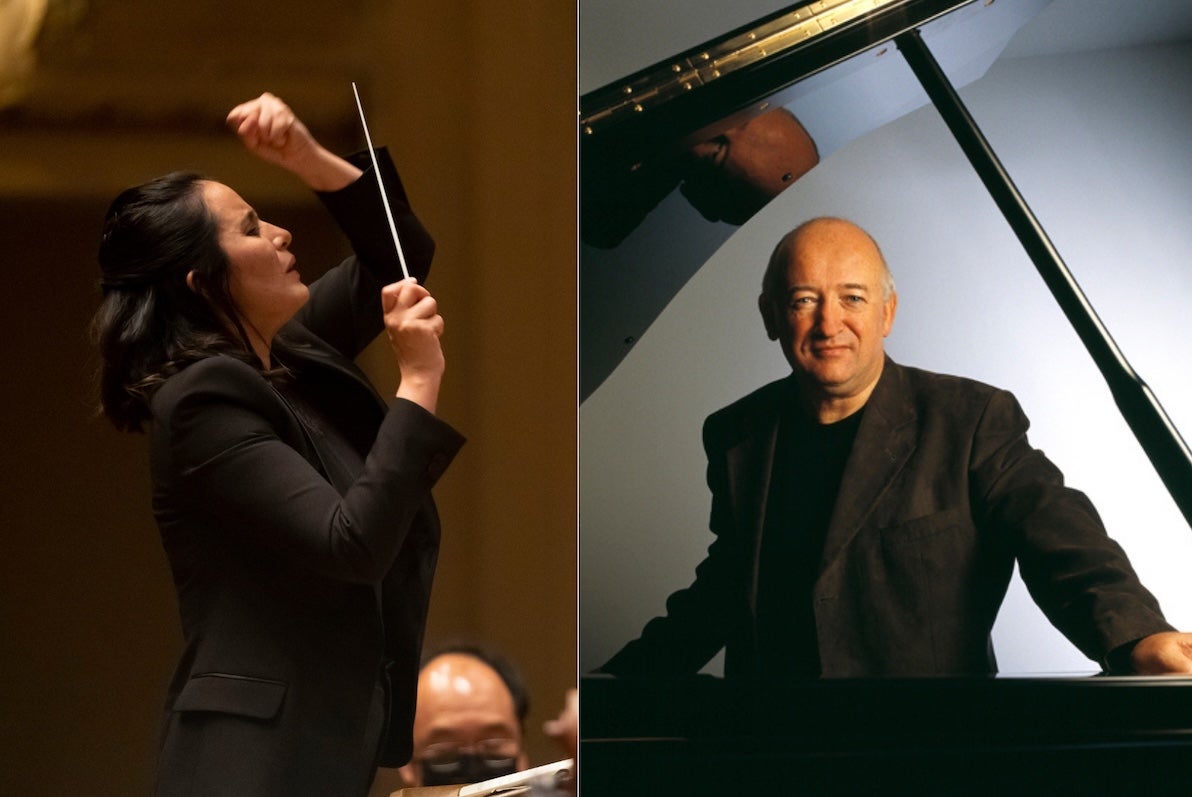 A man dressed in black leaning on a grand piano and a woman conducting with a baton.