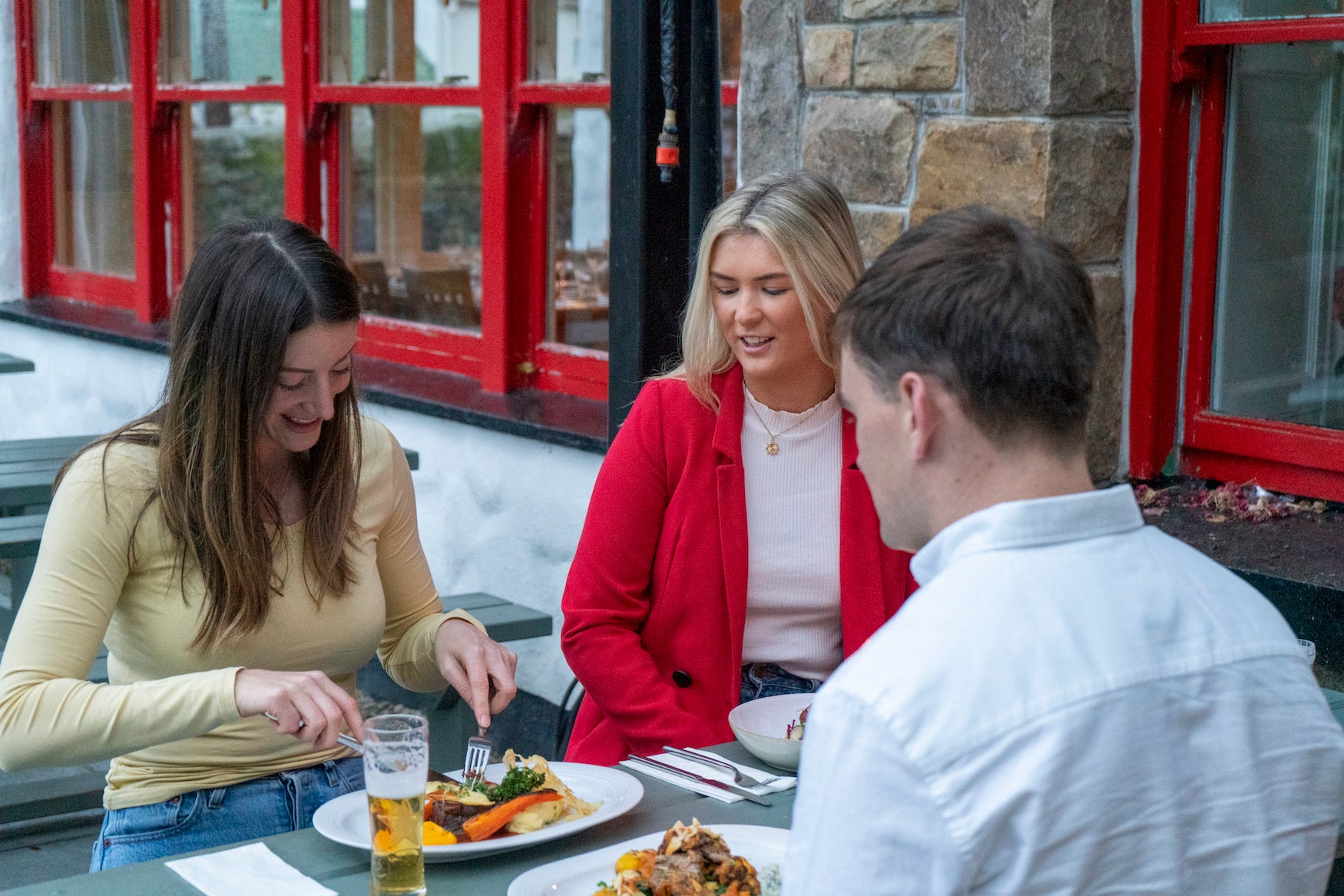 Three people eating at Larkins in Garrykennedy, County Tipperary.