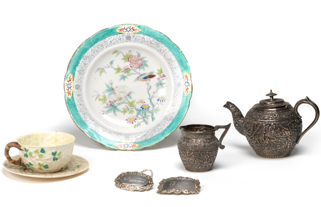 Objects from NMI's handling collection, including ceramics cups and plates, silver drinks labels, teapot, and milk jug