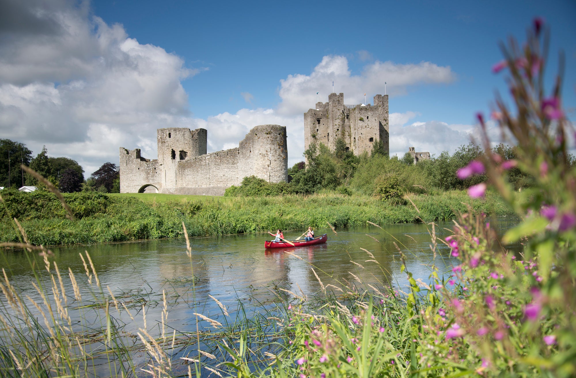People canoeing past Trim Castle in Co Meath