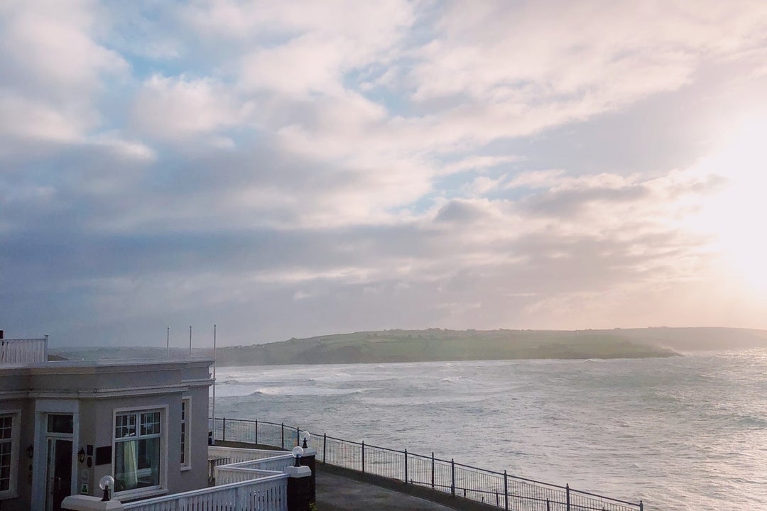 View from a house of the sea with land in the distance