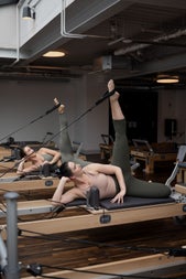 People lying on benches stretching their legs
