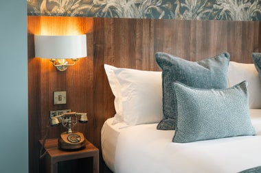 View of bed with white sheets