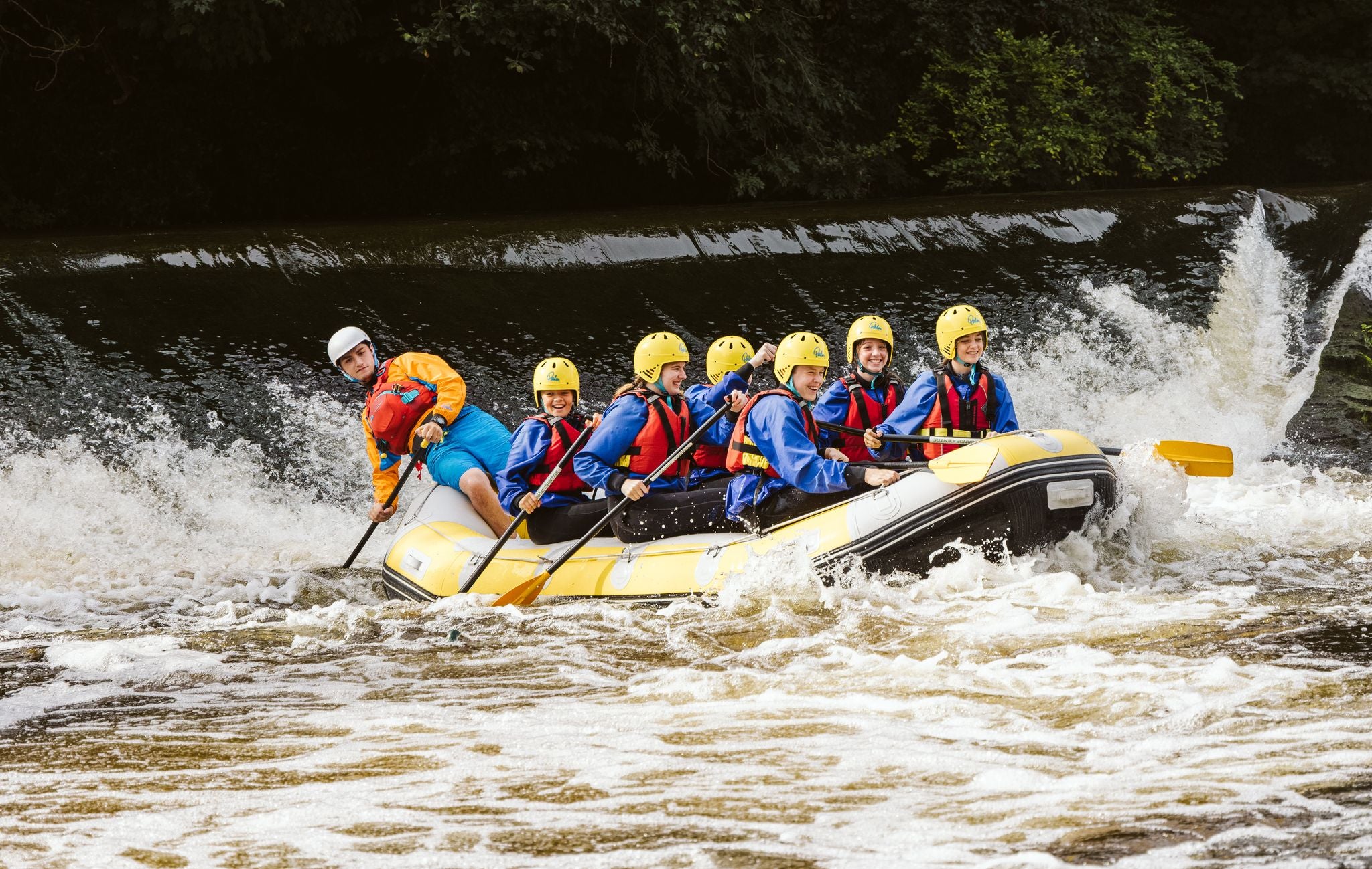 A group of people water rafting in County Dublin