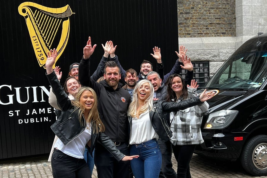A group of people outside St James Gate in Dublin City