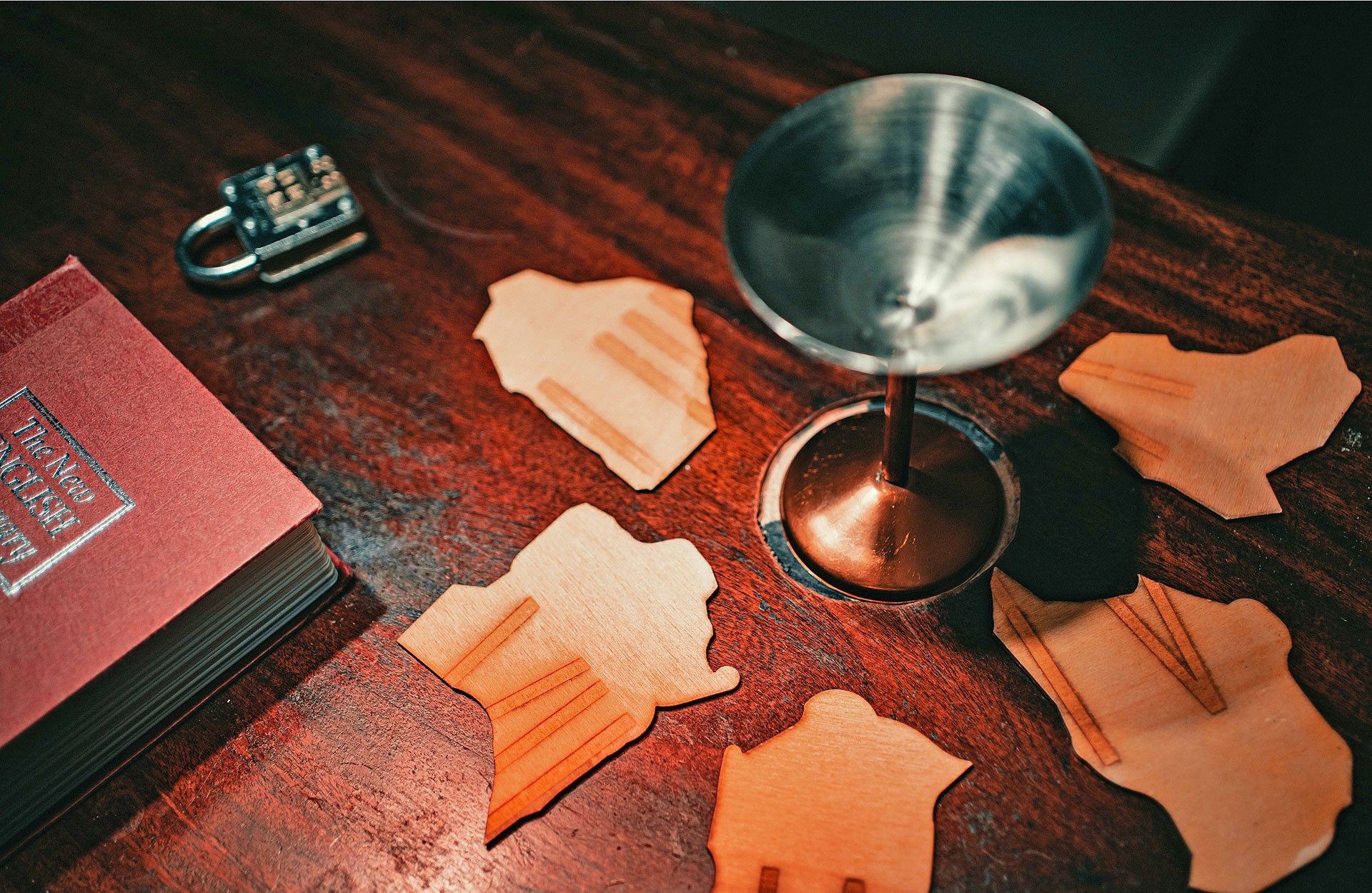 Inside Castlebar Escape Room with puzzle pieces a book a lock and a goblet on a table