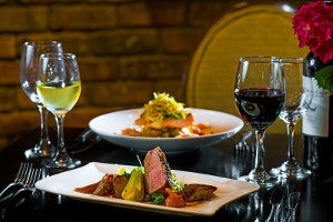 Table with salmon and duck dishes