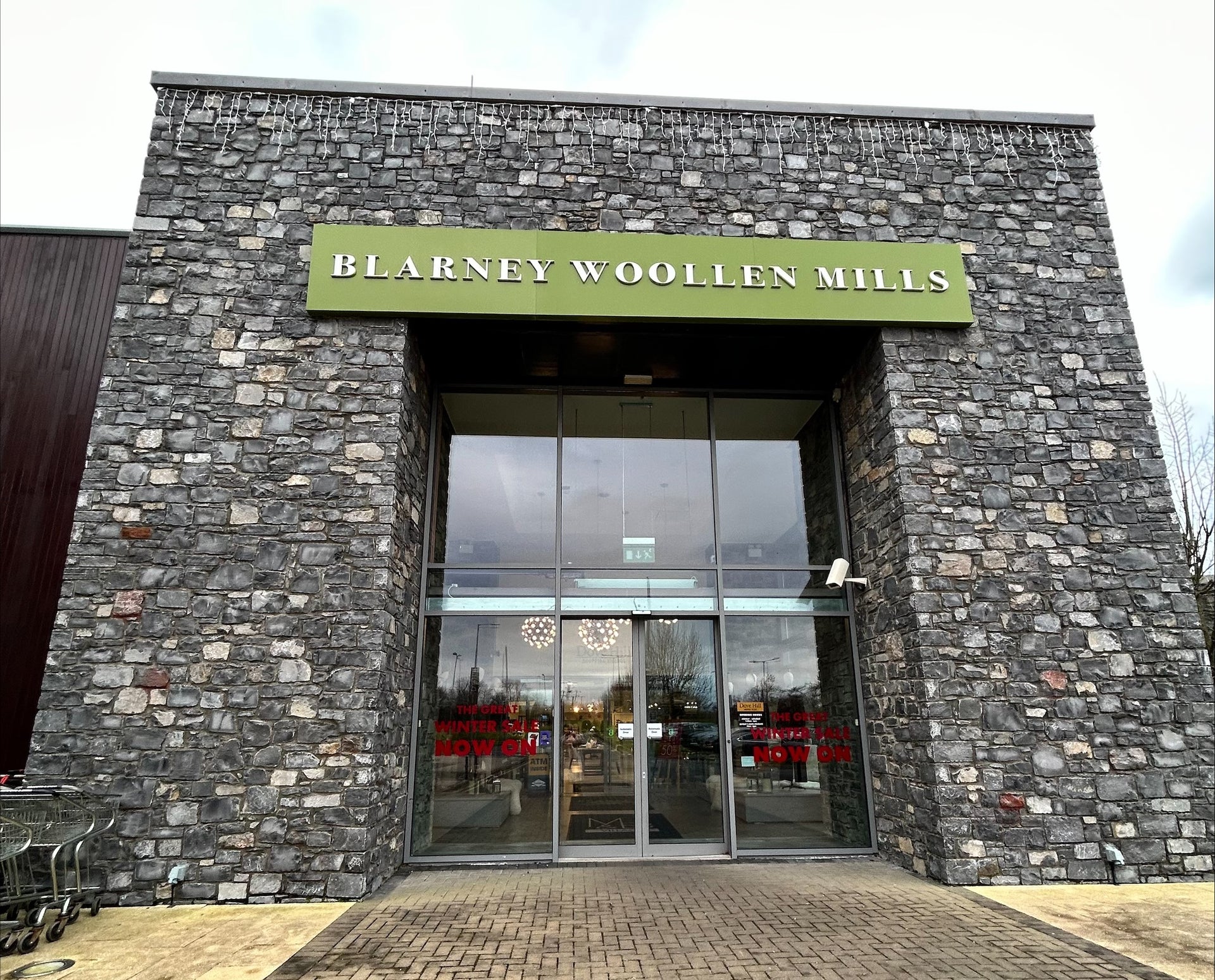 Exterior of a retail outlet with grey bricked walls