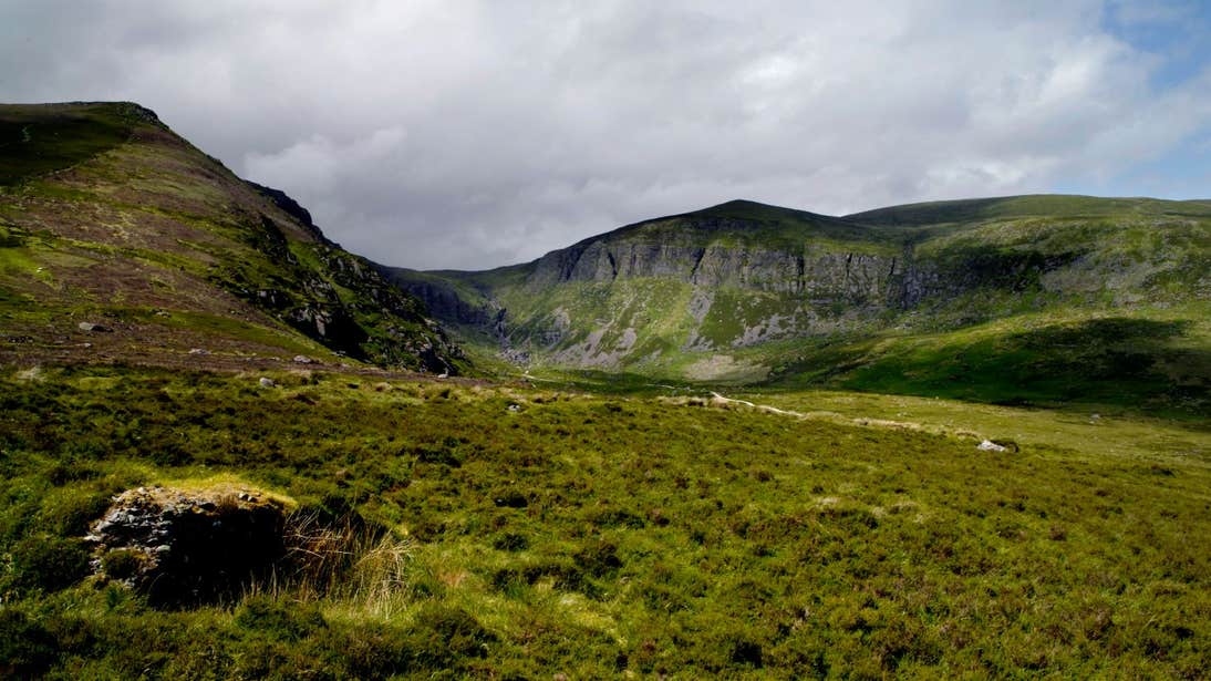 Lush green hills in front of Mahon Falls, County Waterford