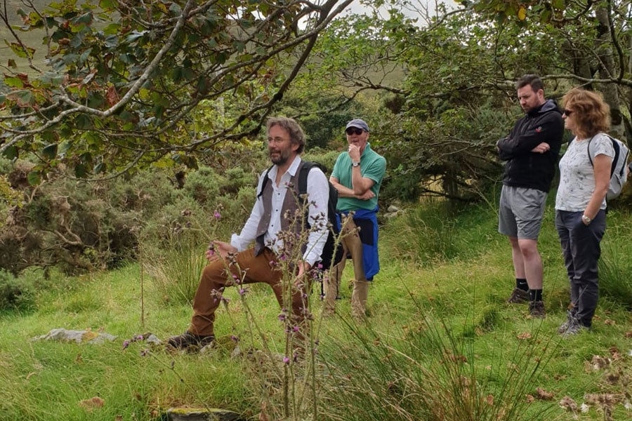 People enjoying The Colony Tour and exploring the historic ruins of the Achill Mission