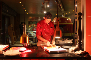 Image of chef preparing Pizza