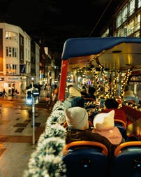 A photo from the top deck of the bus. Father and Daughter enjoying the views of the Christmas Lights Tour