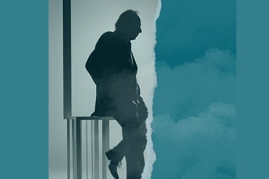 Side profile silhouette of man leaning on railings