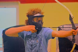 A person using a bow and arrow