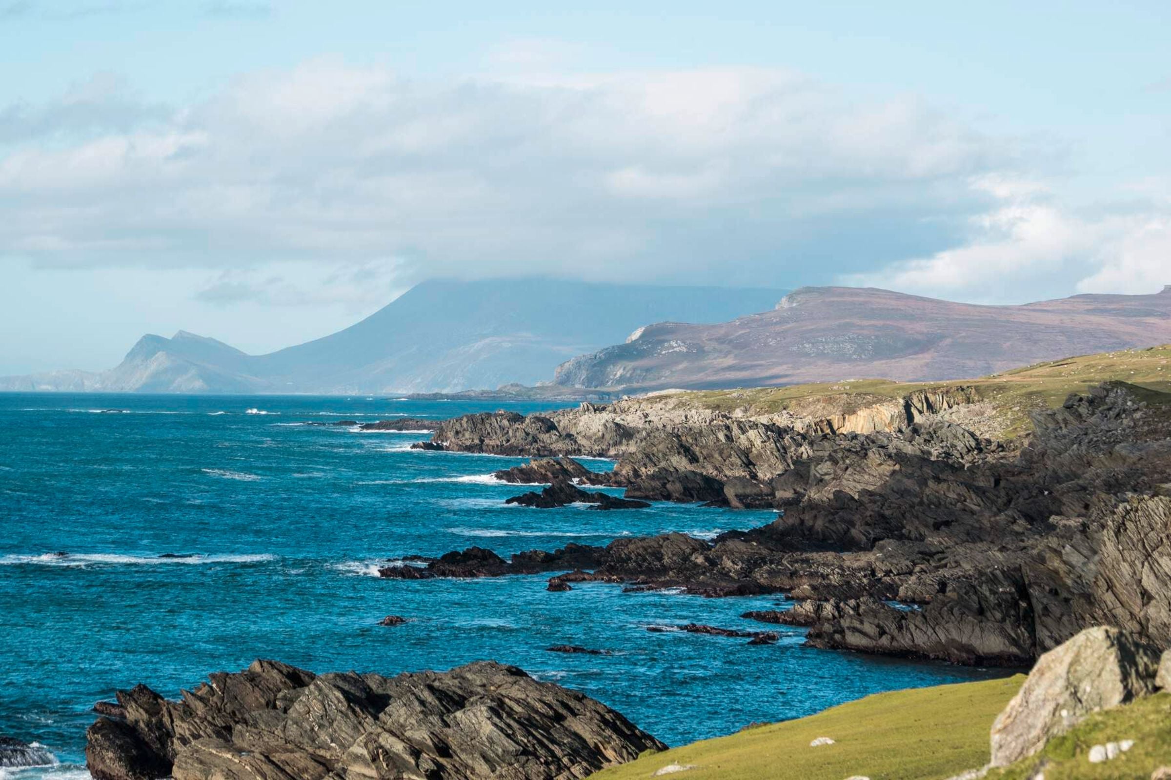 Vivid blue water of Ashleam Bay in County Mayo.