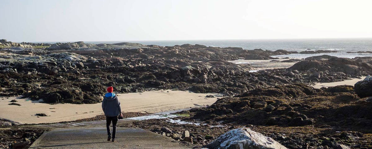 Person looking at view from Ballynahown Pier