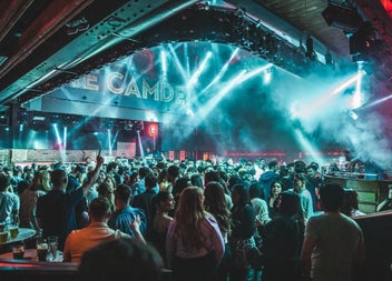 A crowd enjoying a disco with dramatic lighting