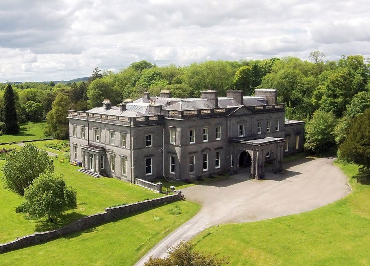 An aerial view of Temple House Estate sitting amid green grounds and trees