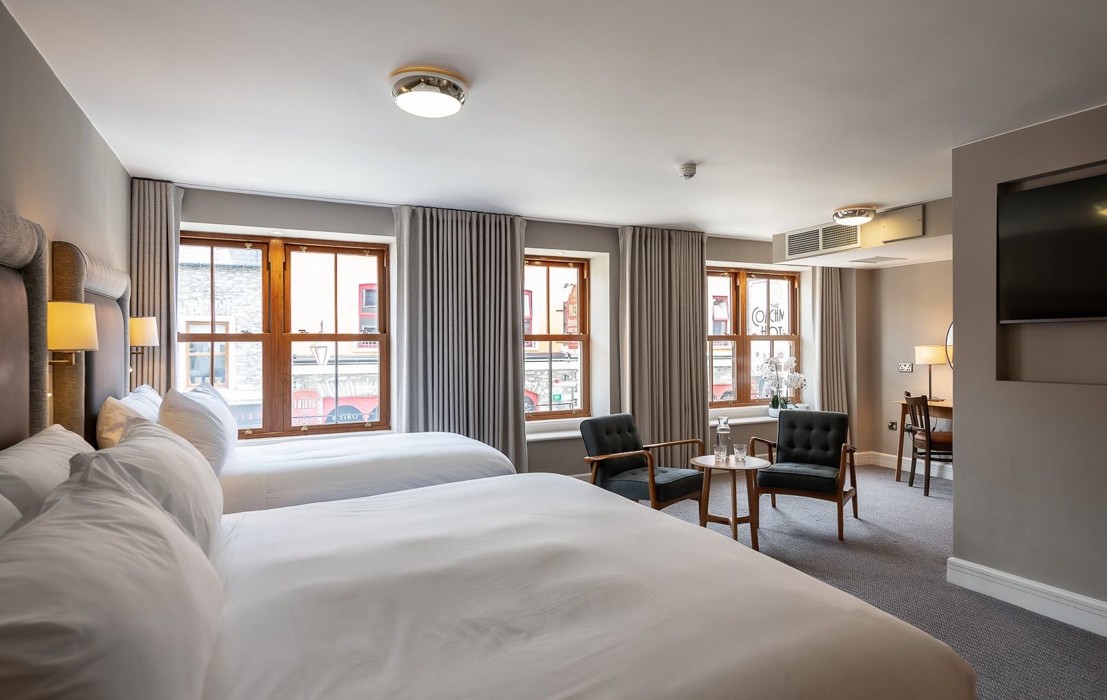 Bedroom with two beds and seating area