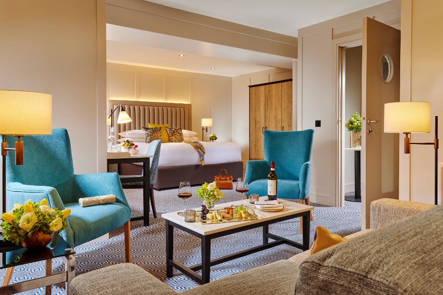 Junior suite with comfortable chairs.