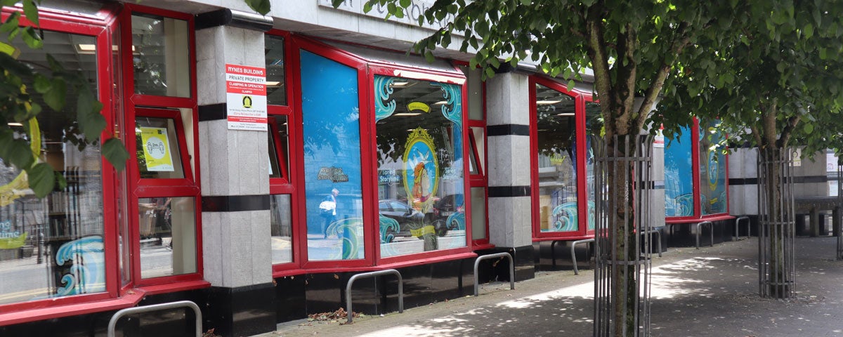 The exterior of Galway City Library with lots of brightly coloured windows