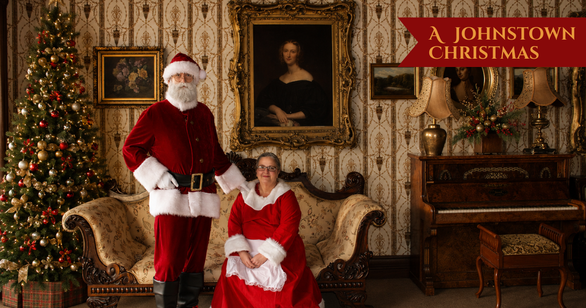 Santa and Mrs Claus pose for a photo in our drawing room.