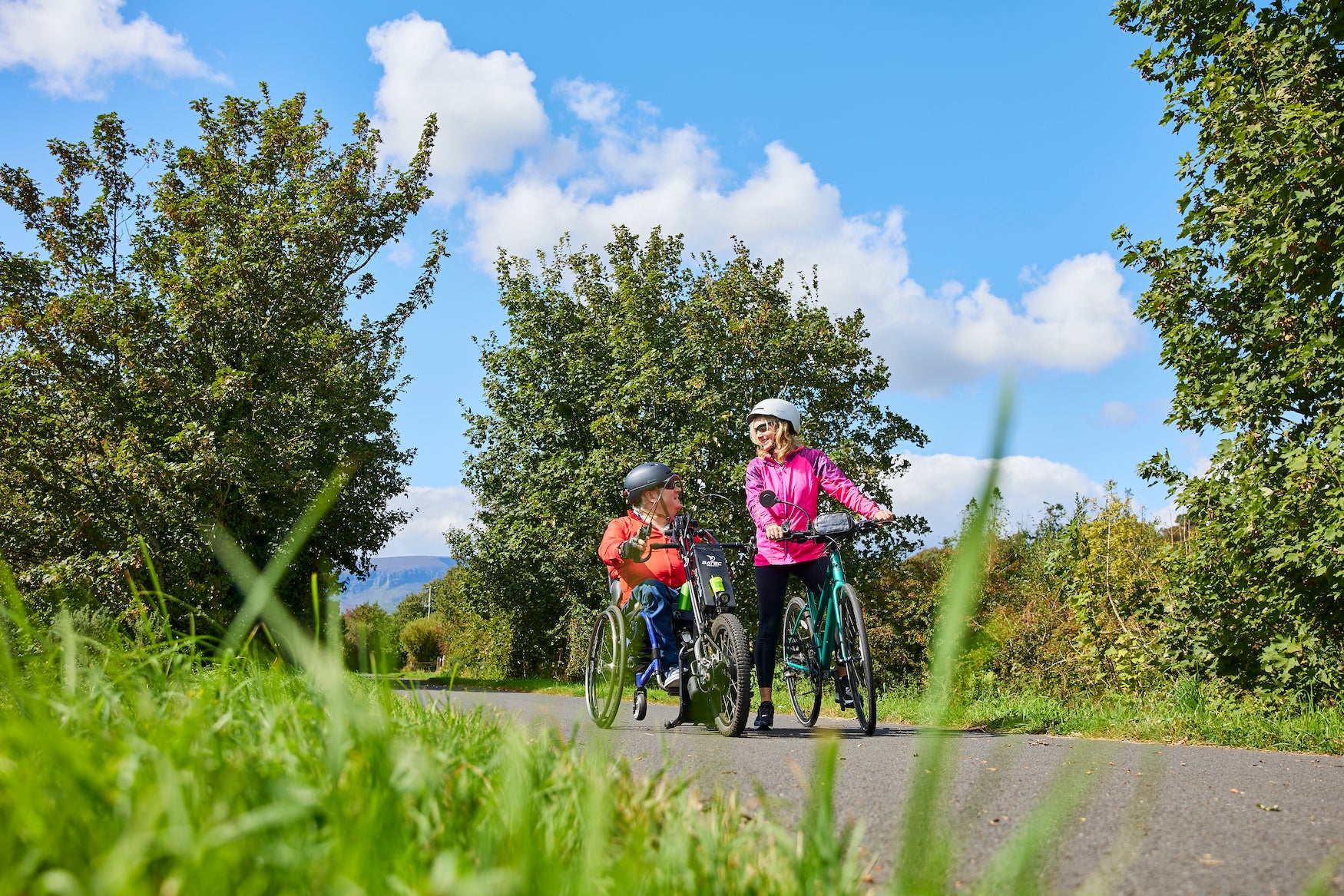People cycling the Waterford Greenway
