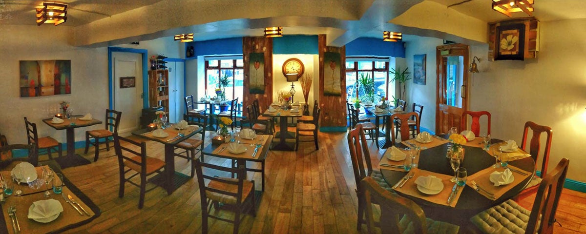 Interior image of Blue Serenade Restaurant with tables set for dinner